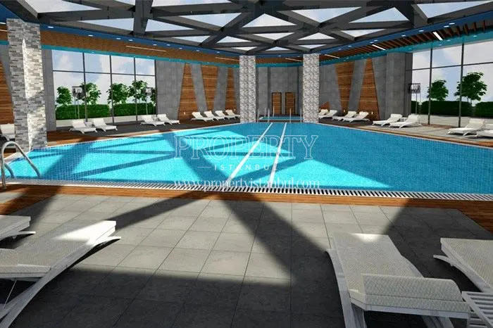 Indoor swimming pool with a glass ceiling in Elite Concept