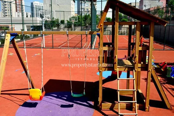 Kids’ playground and sports fields in the Elitist Park compound