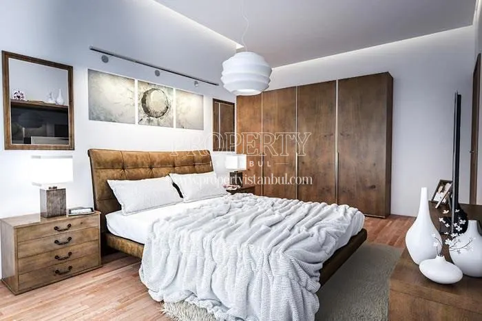 Master bedroom with wooden furniture in Elysium Apartments Lale