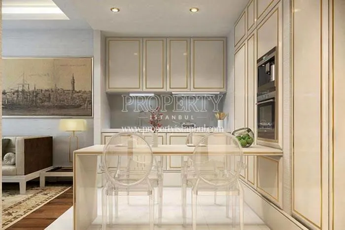Golden striped white kitchen cabinets in Elysium Art Sisli's sample apartment