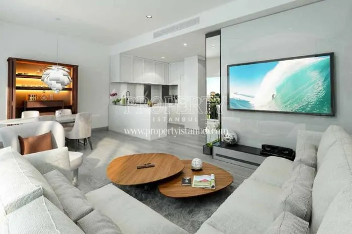 The small living room with a white corner couch in Elysium Serenity Kandilli