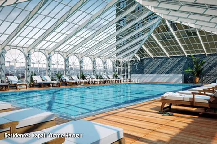 Indoor swimming pool with a glass ceiling in Emaar Square