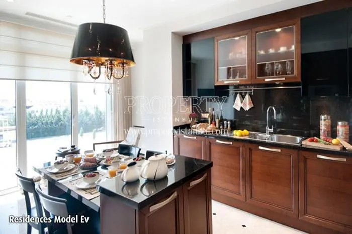 The kitchen with brown kitchen cabinets in Emaar Square