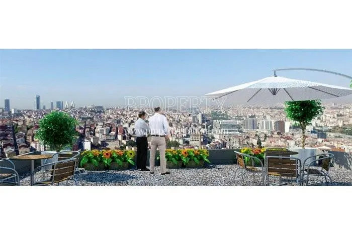 The men viewing the city view from Erka Panorama