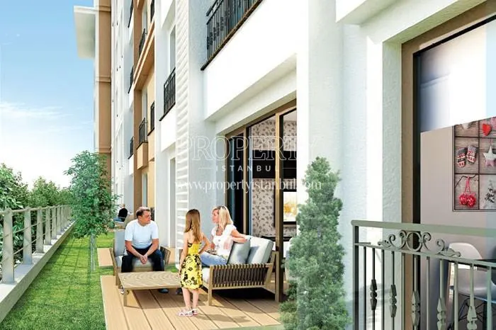 The family resting on the balcony in Esenler Emlak Konutlari