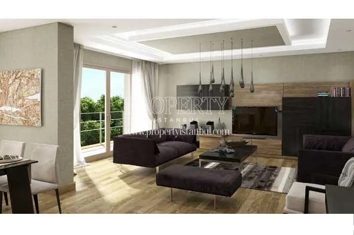 Spacious living room with a claret red lounge suite in Essa Flora