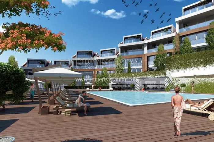 Eurotolia Panorama Evleri residents swimming in the compound pool