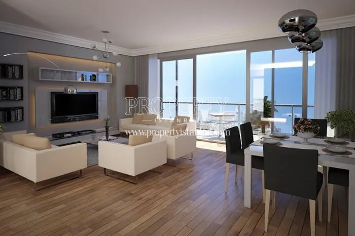 The spacious living room with a balcony