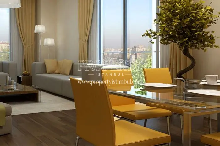 Yellow chairs around the glass dining table in the living room in Evra Life