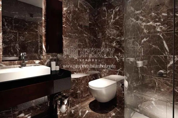 Small washroom with black tiles in Finans Evleri