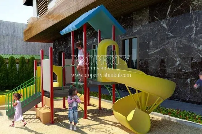 Children playing in the kids' playground in Finans Evleri
