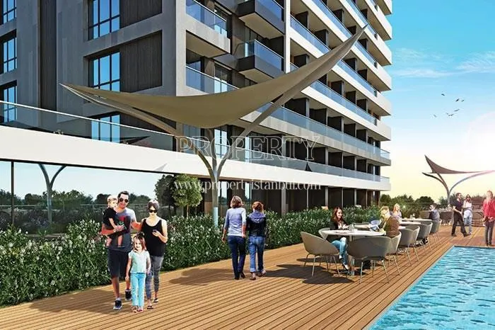 Fortis Istanbul residents enjoying themselves near the swimming pool
