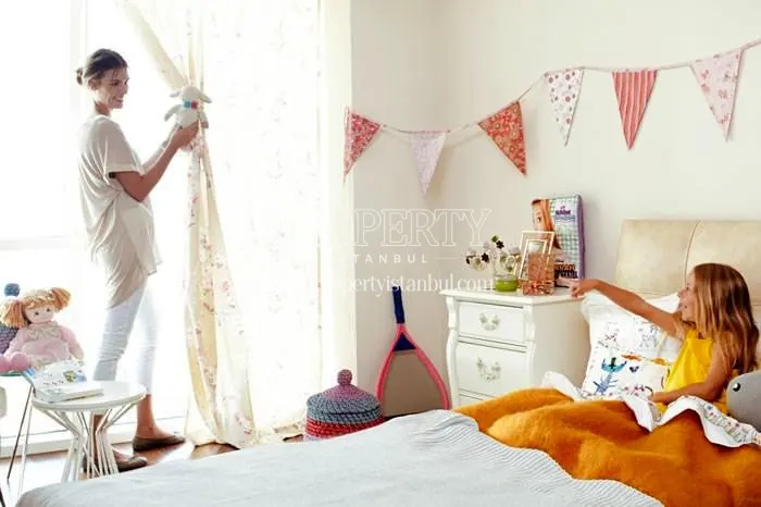 A mom and her daughter in their home in Four Winds Residence