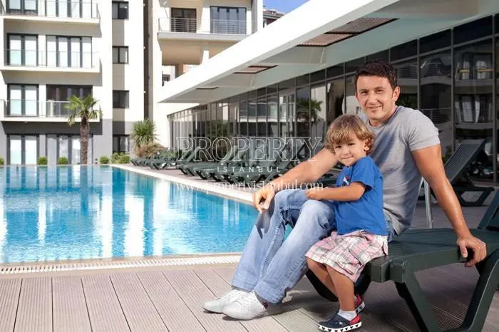 The man and his son near the swimming pool in Glow 3