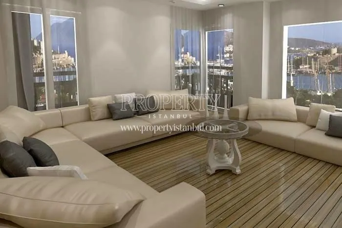 Cream colored lounge suite in one of the living rooms in Guverte Evleri