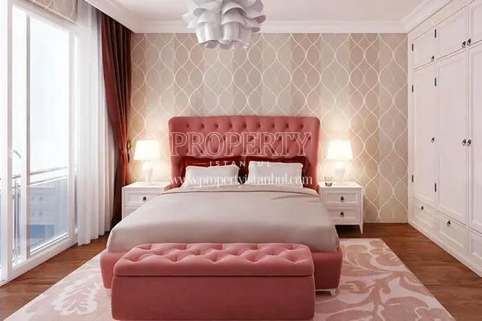 Red double bed in one of the Hayat Residence apartments