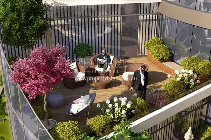 The guys resting on the verdant balcony in Helezon Plaza