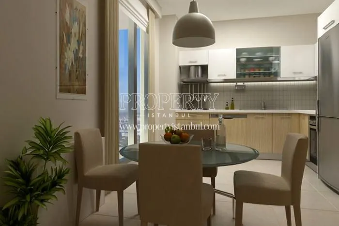 The kitchen with a balcony in Huzzak Tower Plus