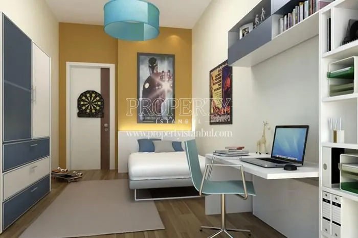 Blue and white furnished bedroom in Huzzak Tower Plus