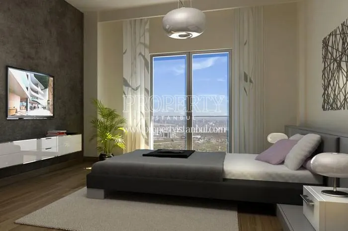 The small master bedroom with the city view in Huzzak Tower Plus