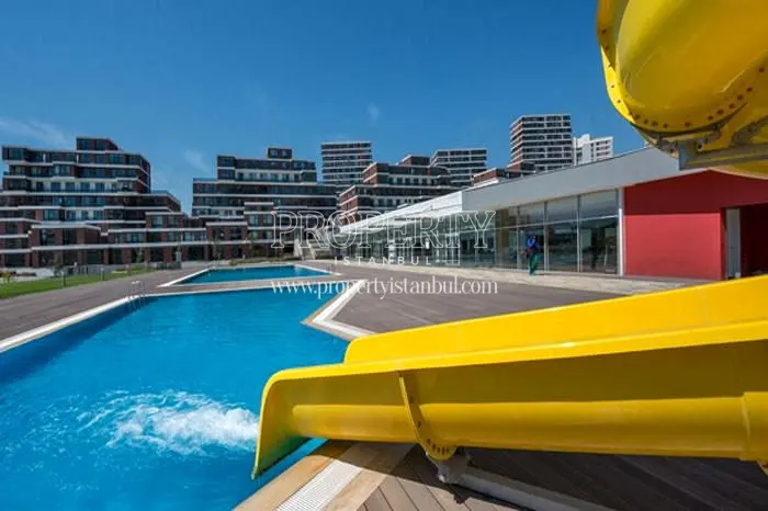 The yellow slide in the swimming pool of the Istanbul Lounge complex