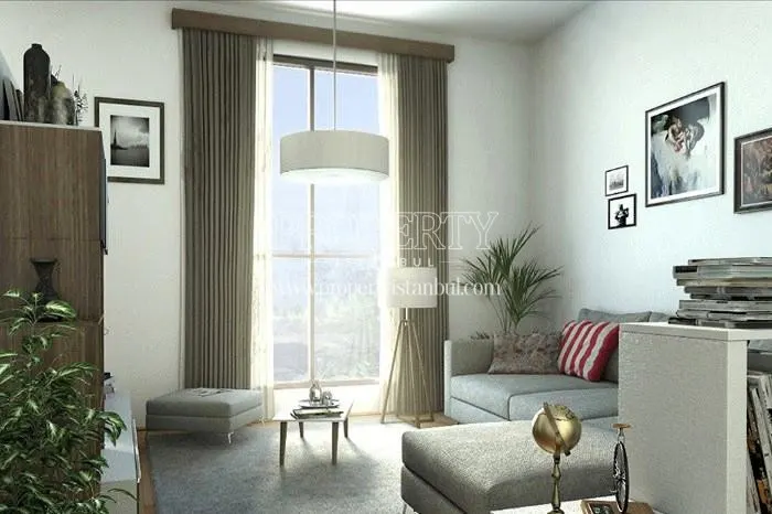 Small grey corner sofa in the small living room in Iva Suites Kagithane