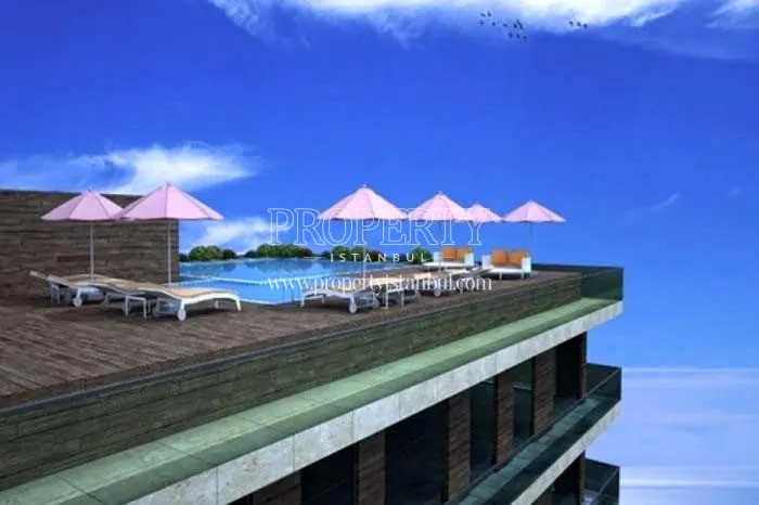 The outdoor swimming pool on the Kapanarya Gold Evleri building