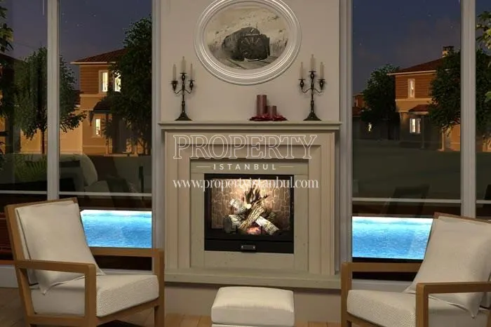 The living room with a fireplace in one of the luxury villas in Kasaba 3. Etap