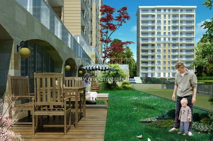 The man playing with his son in the Kayacity Residence compound