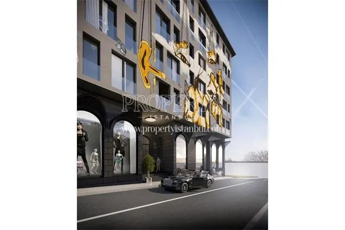Luxury car stopping in front of the Keten Papilio Bomonti building
