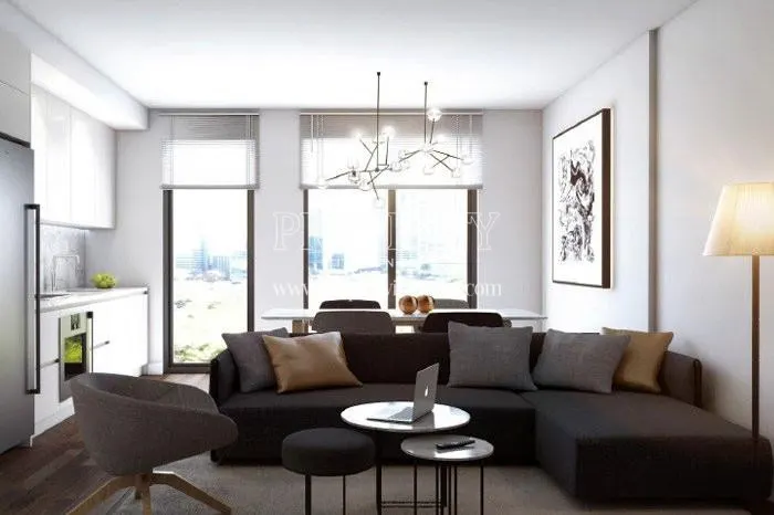 Small black corner sofa in one of the living rooms in Keten Papilio Bomonti