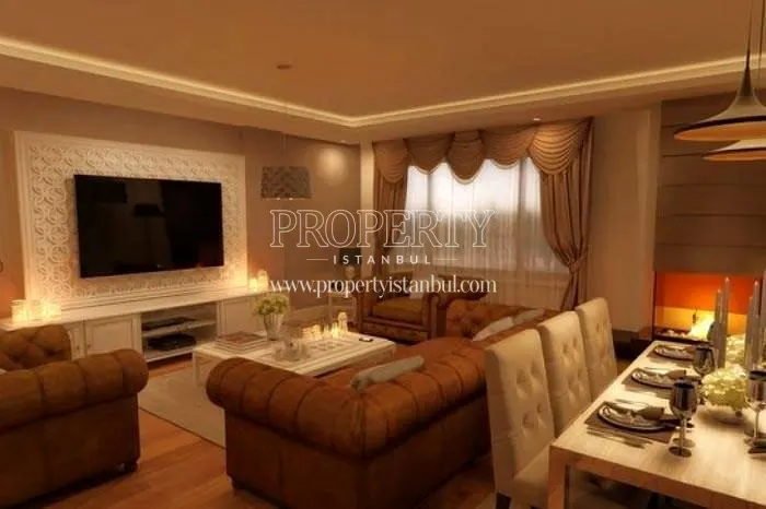 Big television in front of the dining table in one of the living rooms in Kirazli Bahce