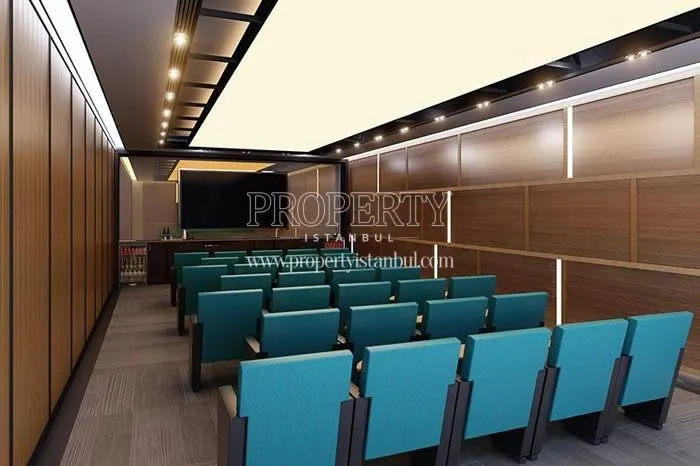 The small conference hall with blue seats in Lea Caglayan