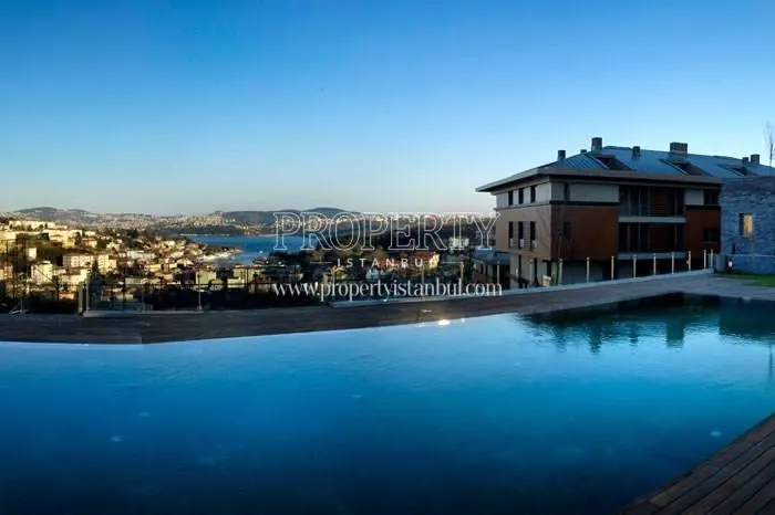 Large outdoor swimming pool facing the sea view in L'ist Istinye Suites
