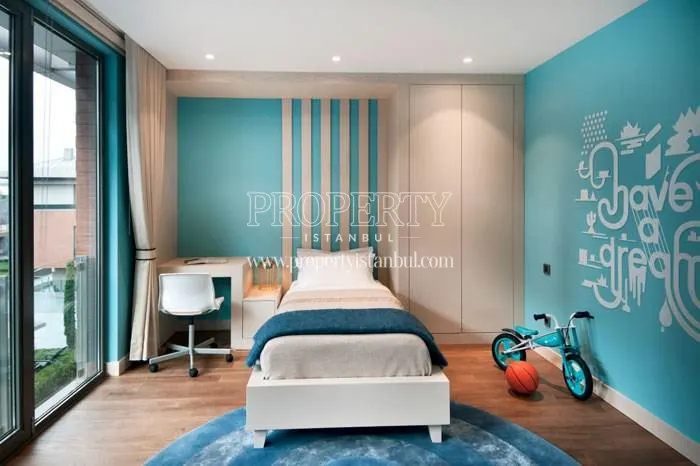 The bedroom with blue walls in L'ist Istinye Suites