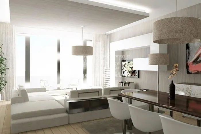 Large white corner sofa in one of the living rooms in Luxera Residence