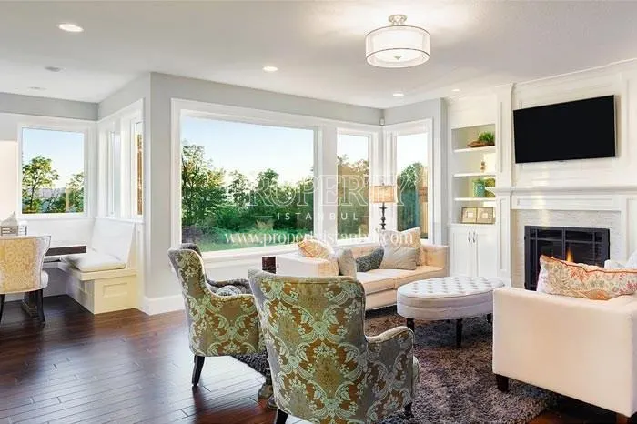 Luxury living room with a fireplace in one of the living rooms in Luxera Residence