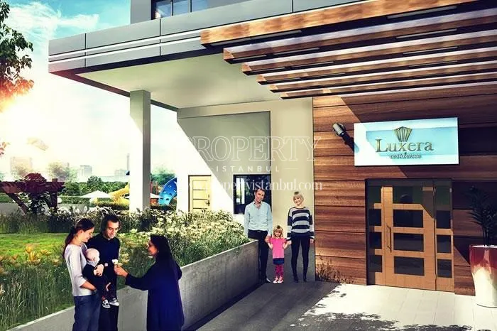 The families in front of the Luxera Residence entrance