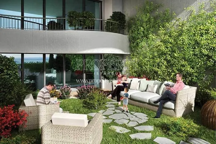 The family reading books on the small verdant terrace of MNG Blue Boutique