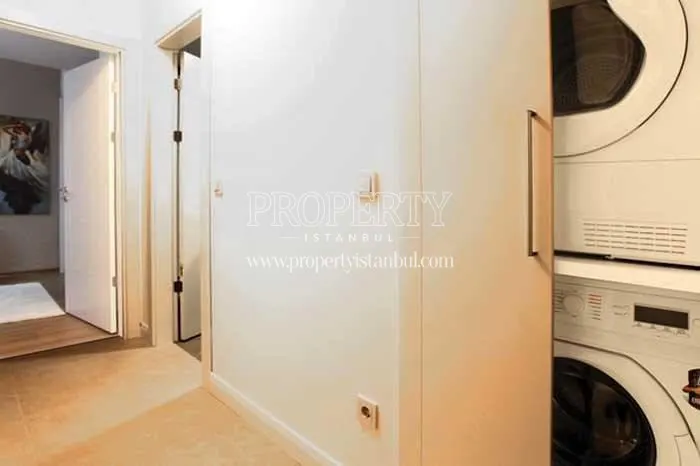 Laundry room in MNG Blue Boutique apartments