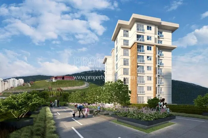 The mountain view with one of the buildings in the Maltepe Evlapark Seyir Evleri compound