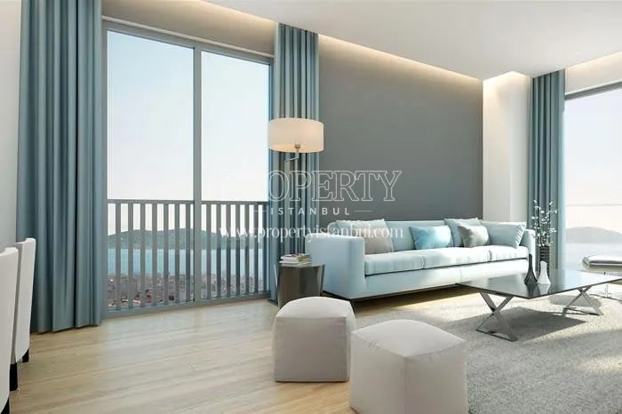 Living room with blue furniture and sea view in Marmara Kule