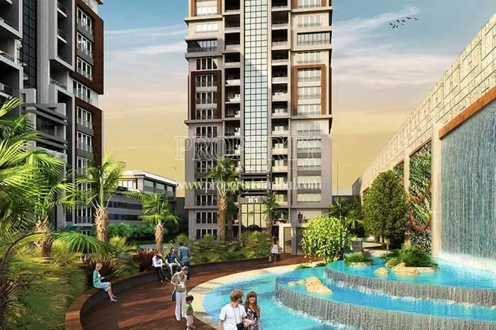 The residents enjoying themselves near the artificial waterfall in Mavera Basaksehir