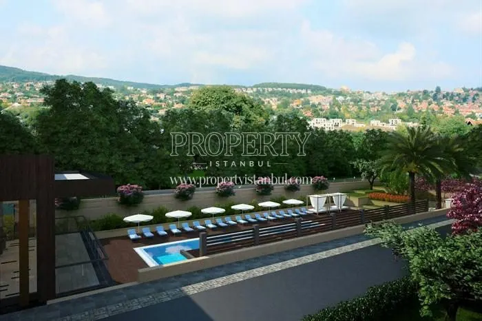Outdoor swimming pool among the trees in the Merkez Zekeriyakoy compound