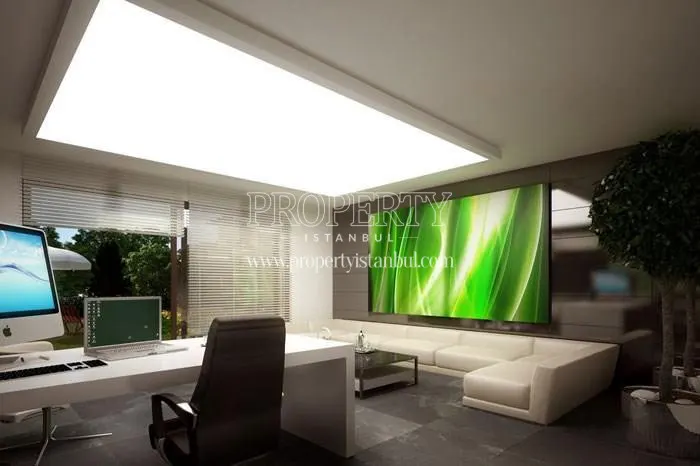 Study room decorated with white furniture in Merkez Zekeriyakoy villas