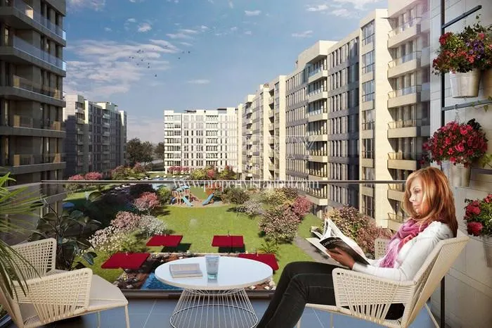 The woman reading a magazine on the balcony in Meydan Ardicli