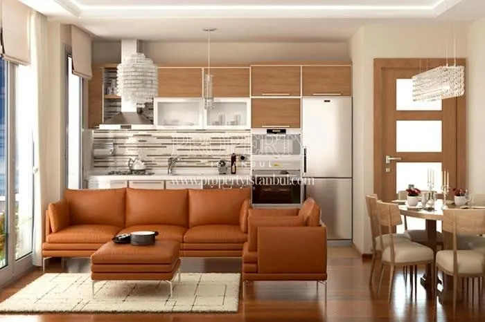 Small living room with an open designed kitchen in Mihenk Rezidans