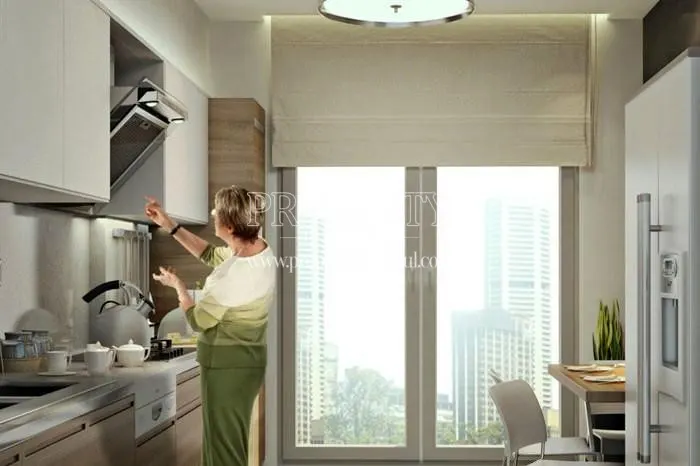 The lady cooking in the kitchen in Nevsa Konaklari