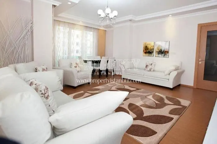 The living room with a white lounge suite in New Yakacik