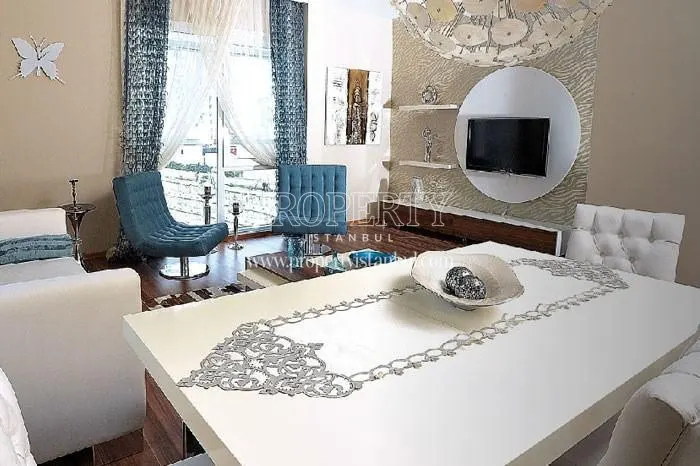 Blue and white furnished living room in Newista Life Basaksehir